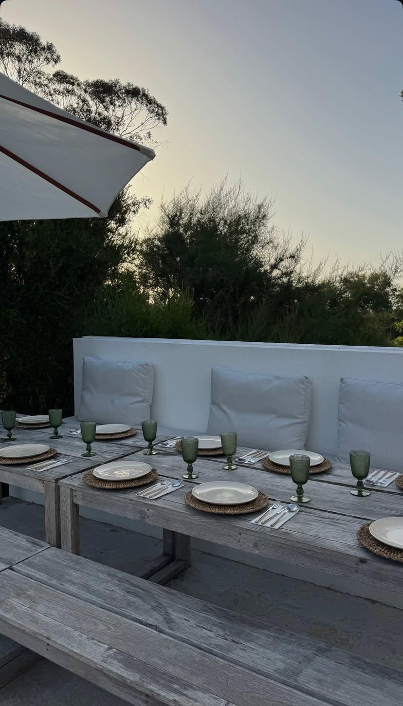 Outdoor dining table set for a sunset meal