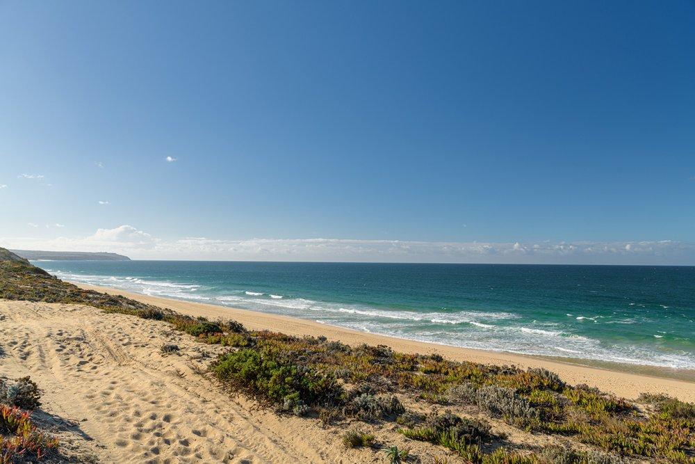 The beach near the retreat venue, with dunes and rolling surf