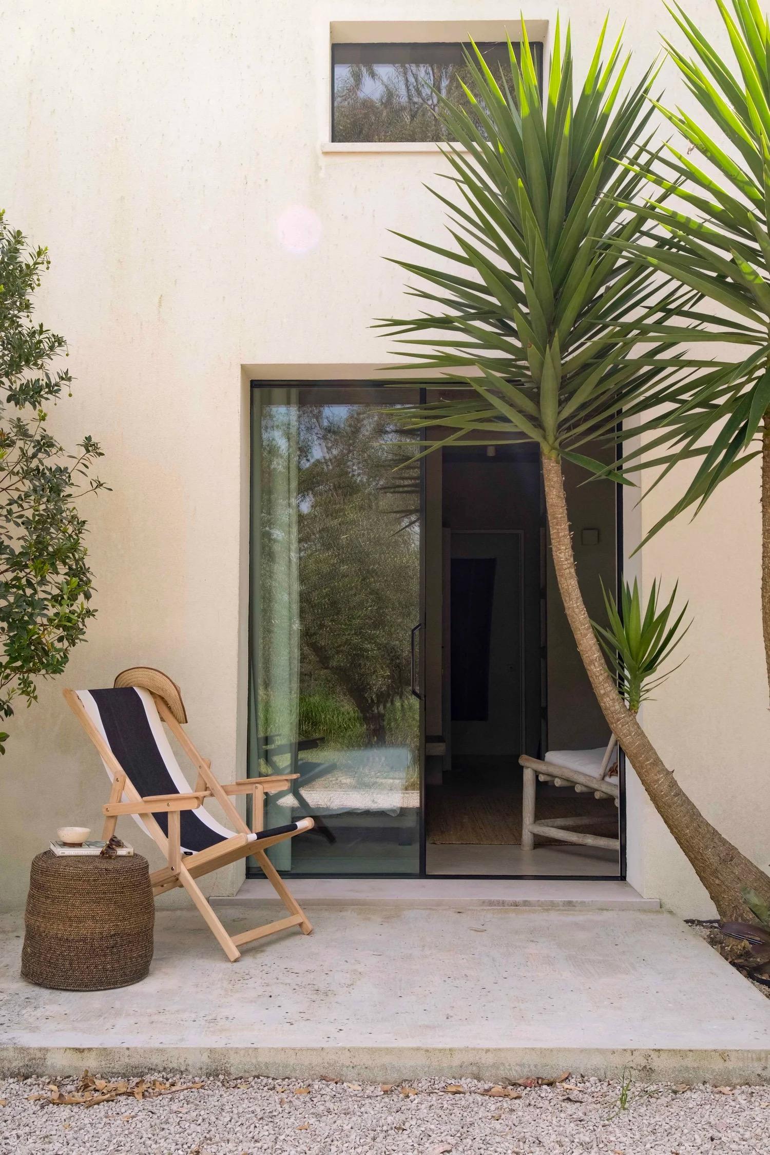 Private balcony with a lounge chair outside a guest room