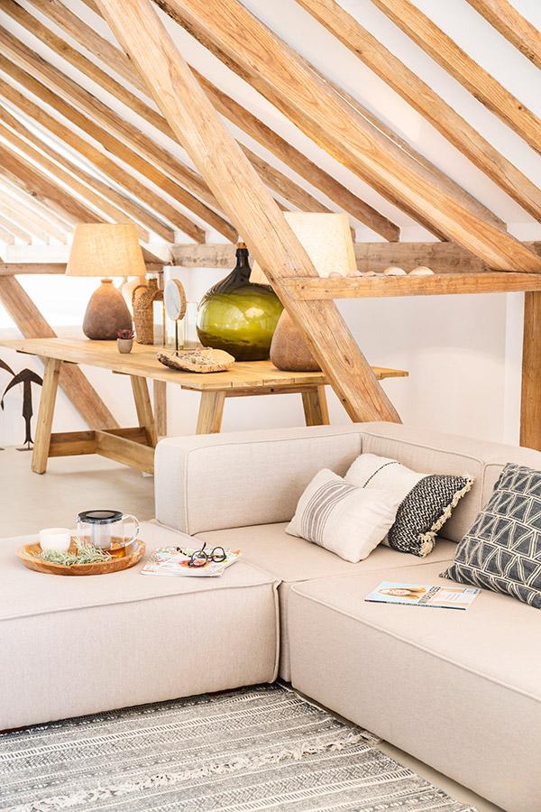 Cozy wood-beamed lounge nook at the retreat venue